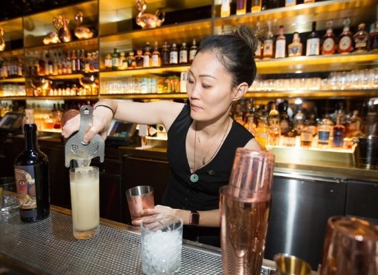 Juyoung Kang preparing a cocktail at The Dorsey at The Venetian Resorts