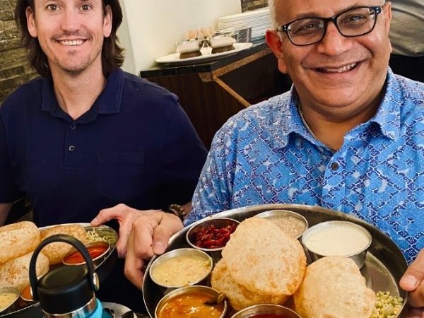 Picture: Raj and Ryan indulged in a traditional Indian dish called Thali that tourists rarely experience. Raj Sabharwal, founder of Glass Revolution Imports.